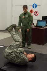 Practicing parachute landings as SERE Specialist TSgt Tony Fancher critiques his student
