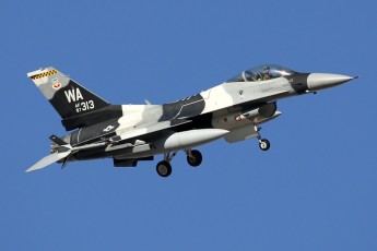 This  64th AGRS F-16C Viper, with an Arctic camo scheme, turns onto short final at Nellis AFB.