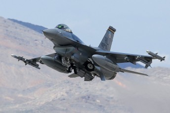 A Block 40 F-16 Fighting Falcon from the 421st Fighter Squadron (421 FS) "Black Widows" departs Nellis AFB during a Red Flag 15-2 launch. 