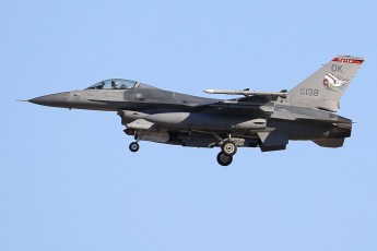 The “Tulsa Vipers” color bird, with its distinctive full color Indian head tail scheme, is on short final into Nellis AFB.