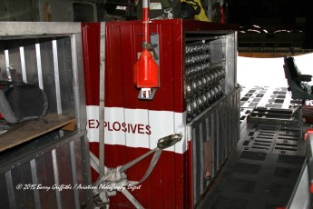 The explosives rack contains a large number of flares, and markers essential to a SAR mission.