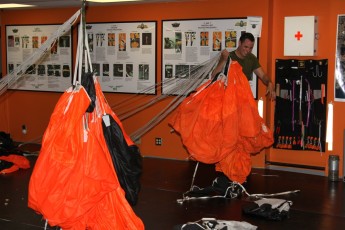 Each SAR Tech repacks their own training parachute.