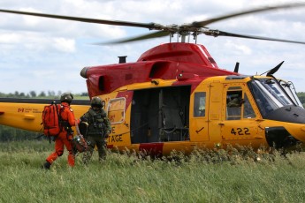 Loading the CH-116 Griffon at end of SAR Tech training exercise.