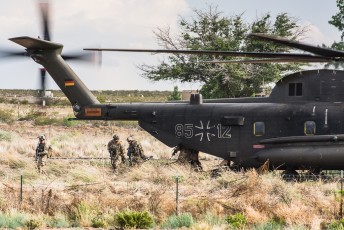 Specialists from the Luftwaffe Kampfretter (German CSAR specialists) depart a CH-53GS Sea Stallion during a rescue mission at the PTRC