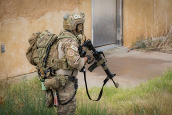 A USAF PJ secures an area during a CSAR mission during Angel Thunder 2015