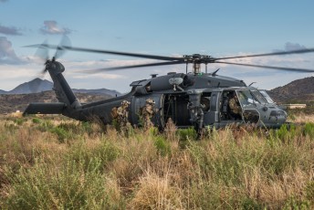 A USAF HH-60G Pave Hawk prepares to depart after securing personnel during a rescue mission as part of Angel Thunder 2015