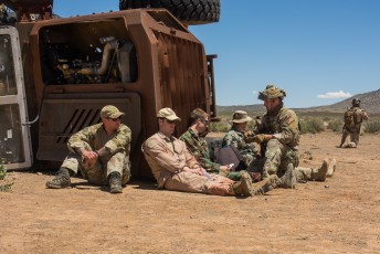 A multinational unit awaits rescue after an IED disabled their MRAP