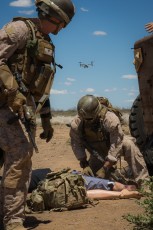 Marines from 1st Force Recon Co. check the vitals on a simulated patient (a smart dummy)  during an Angel Thunder 2015 rescue mission