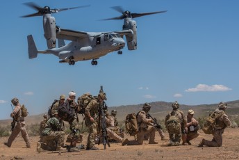A MV-22B Osprey from VMM-268 arrives to pick up injured personnel and Marines from 1st Force Recon Co. 