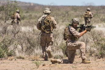Marines from 1st Force Recon Company,  based out of Camp Pendleton, secure an area while rescuing a multinational force from a damaged MRAP