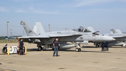 FA-18E #102 of VFA-31 Tomcatters During Pre-Flight Checks, ground crew trainees visible.
