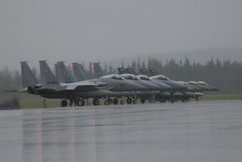 "Last Chance Inspection" for JASDF Mitsubishu F-15J Eagles and 179th FS "Bulldogs" F-16C Vipers before launch in very heavy weather at Eielson AFB.