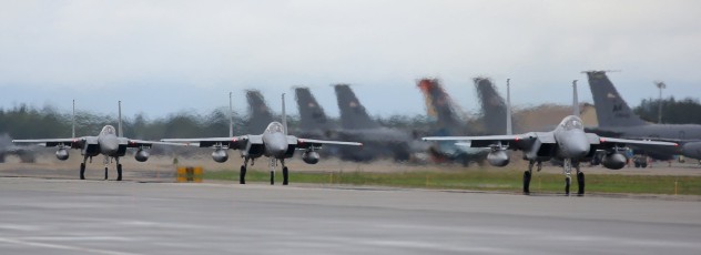 This three-ship of Mitsubishu F-15J Eagles from the 203rd Tactical Fighter Squadron (JASDF) is taxiing to the arming area prior to launch at Eielson AFB.