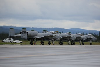 A four ship Blue Air formation from the 25th FS completes its "Arming" and pre-flight inspection prior to launch.