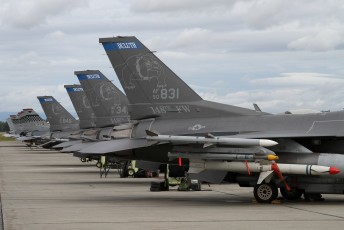 General Dynamics F-16C Vipers from the 179th FS "Bulldogs" and the 36th FS "Flying Fiends" on the flight line at Eielson AFB.