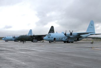 Japan Air Self Defense Force (JASDF) C-130H Hercules transports on the JBER flight line.