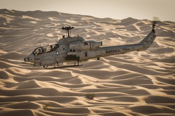 A Bell AH-1W SuperCobra over the Algodones Dunes, also known as the Glamis/Imperial Dunes