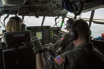 HC-130J (CGAS Elizabeth City, NC) crew in flight for SAREX off the coast of NC/Virginia; Aircraft Commander Maj Rob Jones (RCAF Exchange Pilot), Co-Pilot CDR Rachel Eldridge, Loadmaster Chris Obrien.