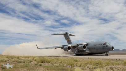 Air Mobility Command C-17A of the 437 AW/315 AW, Charleston, SC "cleans" the runway during take off from Keno Airfield on the NTTR during Joint Forcible Entry Exercise (June 2016).