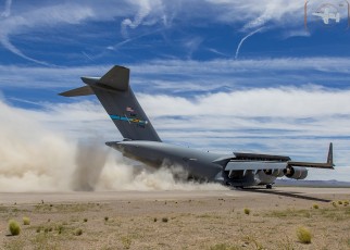 Air Mobility Command C-17A of the 436th Airlift Wing, Dover, DE engages thrust reversers during landing at Keno Airfield on the NTTR during Joint Forcible Entry Exercise (June 2016).