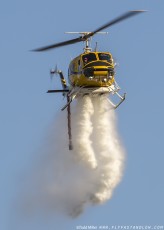 Bell 205-A1 makes water drop on the Azusa Fire on the hills North of Los Angeles June 20, 2016.