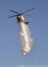 Bell 412EP of Los Angeles Fire Department makes water drop on the Azusa Fire on the hills North of Los Angeles June 20, 2016