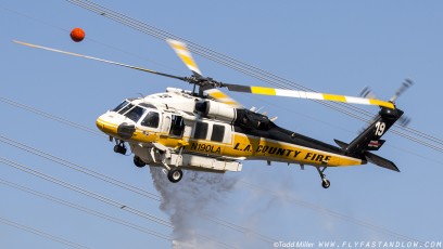 Sikorsky S-70A Firehawk rolls out after making water drop on the Azusa Fire in close proximity to power transmission lines. North of Los Angeles June 20, 2016