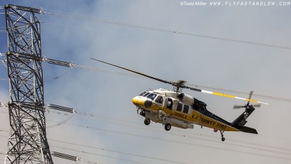 Sikorsky S-70A Firehawk rolls out after making water drop on the Azusa Fire in close proximity to power transmission lines. North of Los Angeles June 20, 2016