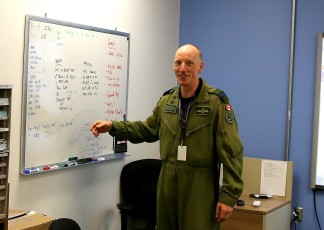Maj. Hirt reviews the day’s flight training schedule.
