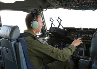 Maj. Duffy at the controls of the CC-177.