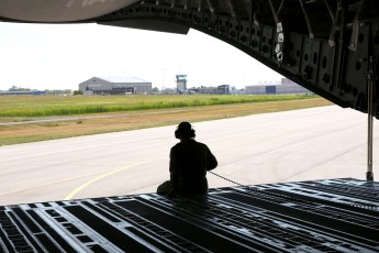 Loadmaster MCpl. Guy Fortier acting as the “rear view mirror” during the back-up operation.