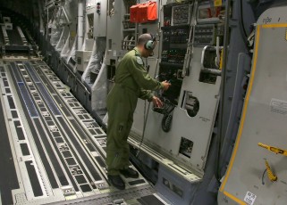 Loadmaster MCpl. Guy Fortier lowers the aft ramp prior to the backup operation.