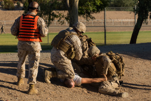 A hostile citizen (a local volunteer acting the role) is taken down by Marines after breaking through a designated barrier