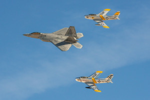 A Heritage Flight of an F-22 Raptor flying with two F-86 Sabres