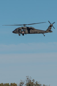 A UH-60A Black Hawk helicopter from Detachment 1, C Company, 5-159th Air Ambulance, based out of Phoenix drops a line to rescue a down pilot during a training exercise