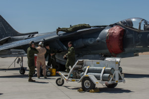 Maintainers from VMA-214 "Black Sheep" work on a AV-8B Harrier II. Their important role is vital to mission success