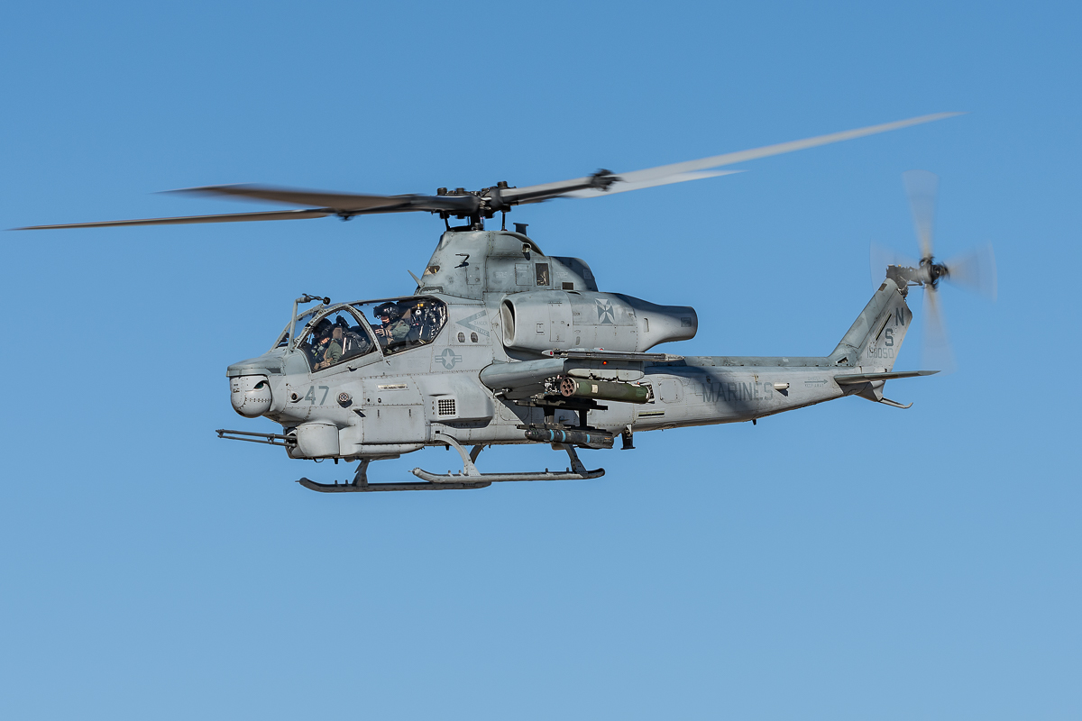 A Bell AH-1Z Viper from Marine Light Attack Helicopter Squadron 169 (HMLA-169) "Vipers" with a photo pass on departure. 