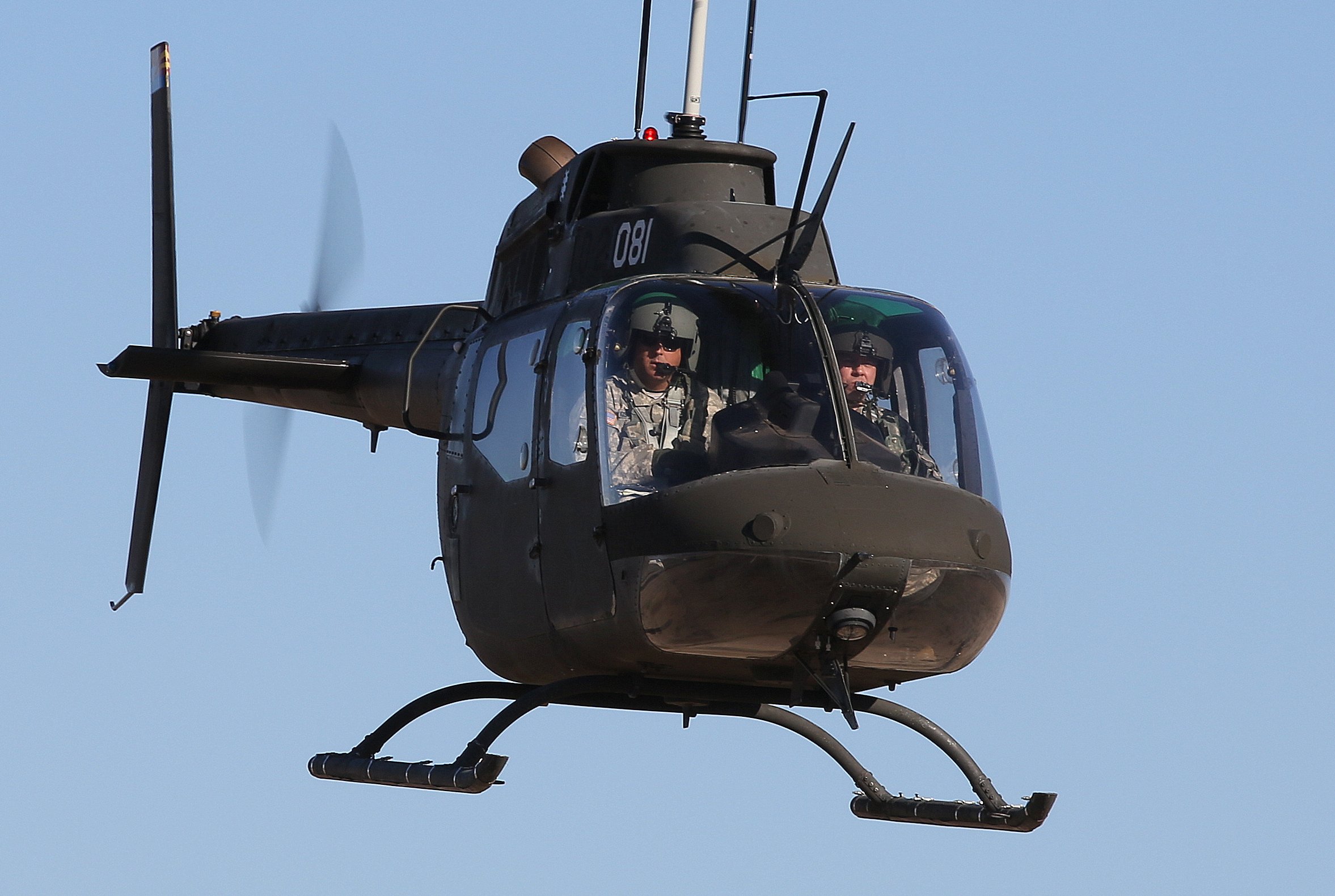 Bell OH-58C Kiowa, with Pilot Instructor and trainee pilot, departing Picacho Stagefield Heliport, AZ