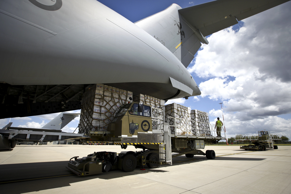Personnel from RAAF Base Amberley load pallets of Australian Aid equipment onto a C-17A Globemaster for dispatch to cyclone affected Fiji. *** Local Caption *** The Australian Defence Force (ADF) is supporting the Department of Foreign Affairs and Trade (DFAT) led Whole of Government assistance to Fiji following the devastation of severe Tropical Cyclone Winston. On 23 February 2016, a Royal Australian Air Force C-17A Globemaster aircraft at RAAF Base Amberley was loaded with Australian Aid humanitarian stores bound for Fiji. Through DFAT, ADF personnel are working in partnership with the Government of Fiji and with the Fiji Red Cross Society, UN agencies and NGOs. Together with Fiji, New Zealand and France, Australia continues to assess the humanitarian impact to see how Australia can best support Fiji in its response effort.