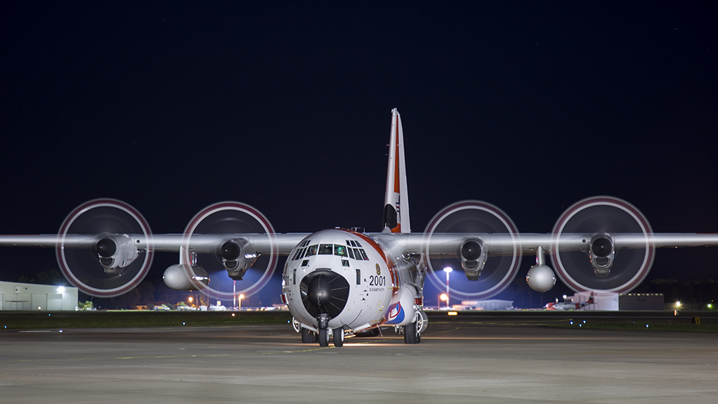 HC-130J of USCG Air Station Elizabeth City returns to base after night flight.
