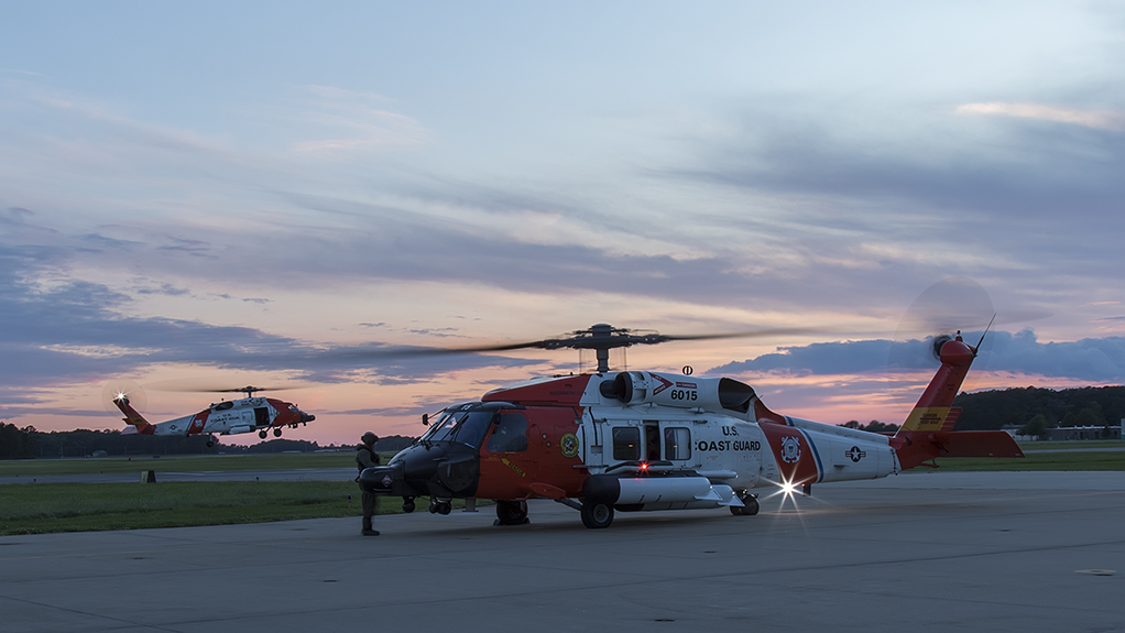 Pair of USCG MH-60Ts departing at sunset for night training missions.