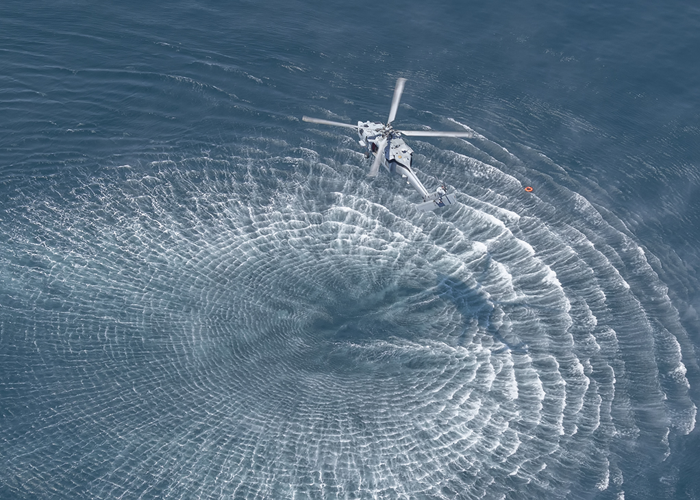 Navy SH-60 closes in on life ring representing a downed pilot during SAREX exercise; May 25; 2016;