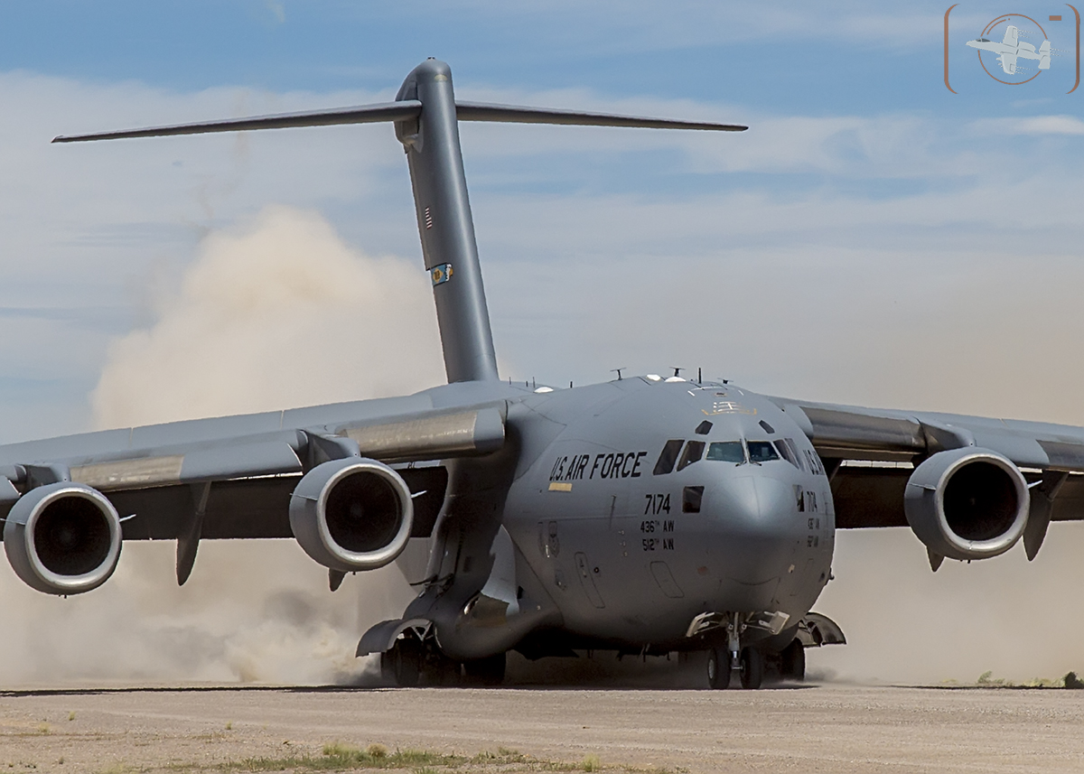 Air Mobility Command C-17A of the 436th Airlift Wing, Dover, DE kicks up the dust as it touches downs at Keno Airfield on the NTTR during Joint Forcible Entry Exercise (June 2016).