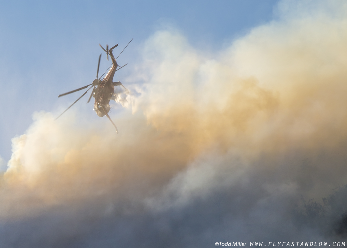 CH-54B obscured by smoke after making water drop on the Azusa Fire on the hills North of Los Angeles June 20, 2016