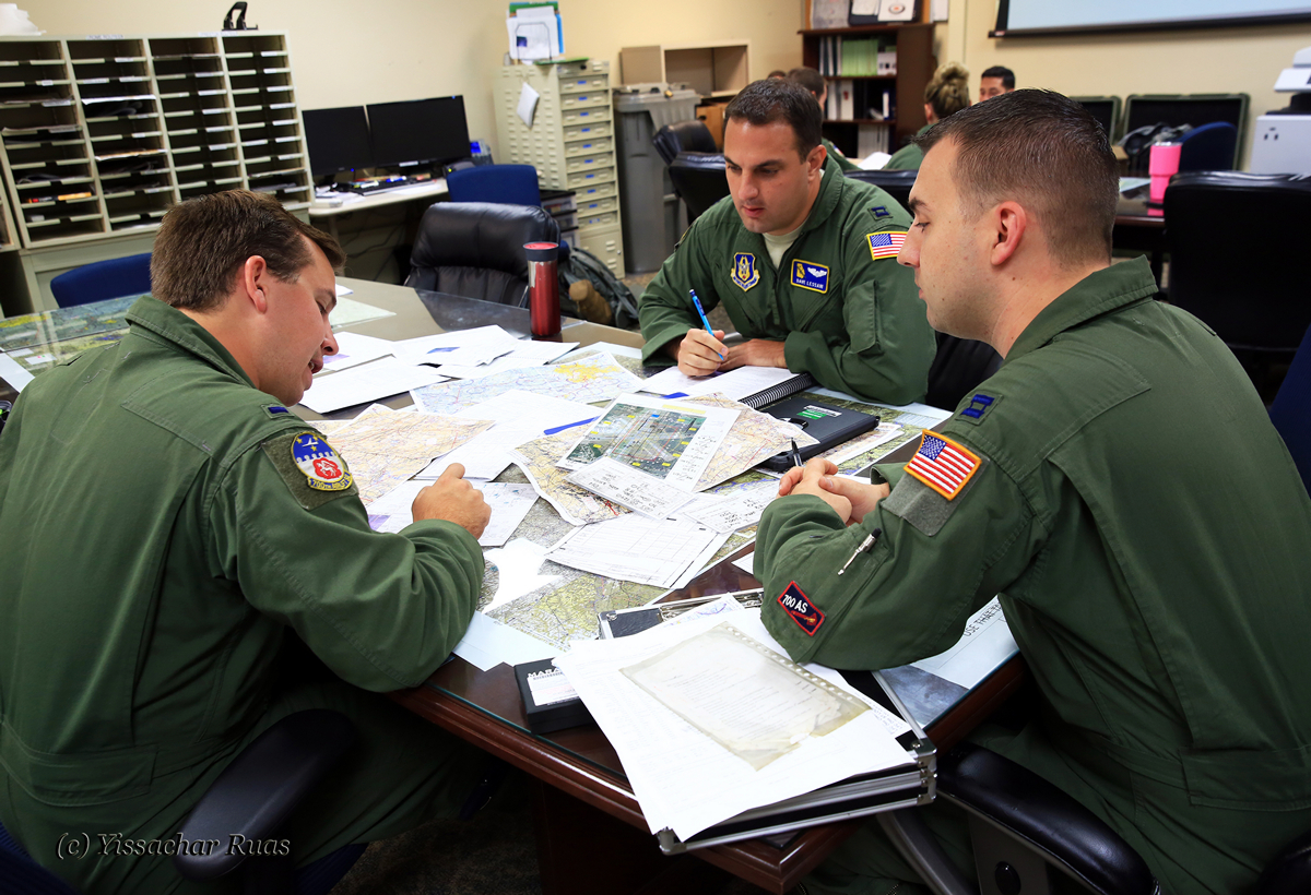 Capt Dave Lessani lead pilot of the second aircraft briefs his crew