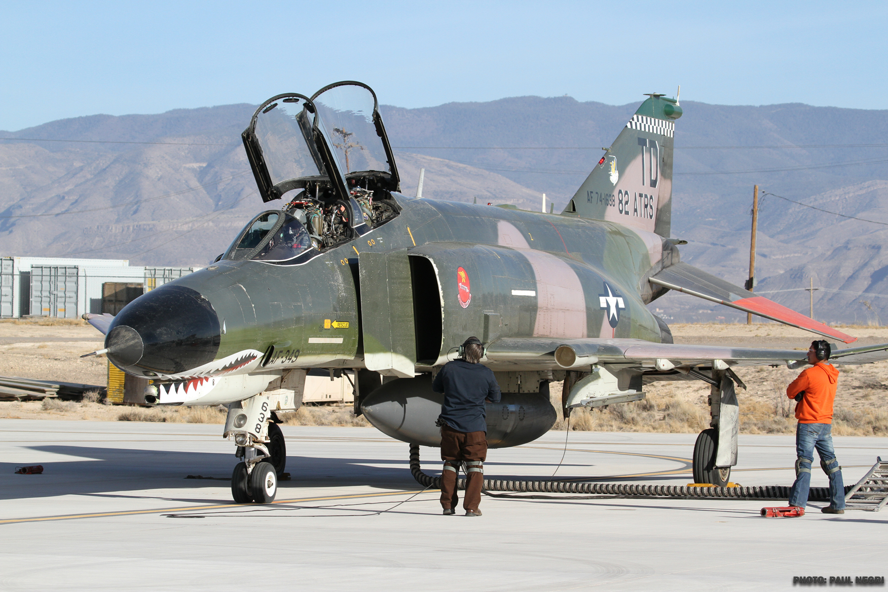 A pilot remotely controls a Q-F4 Phantom as it takes off from the