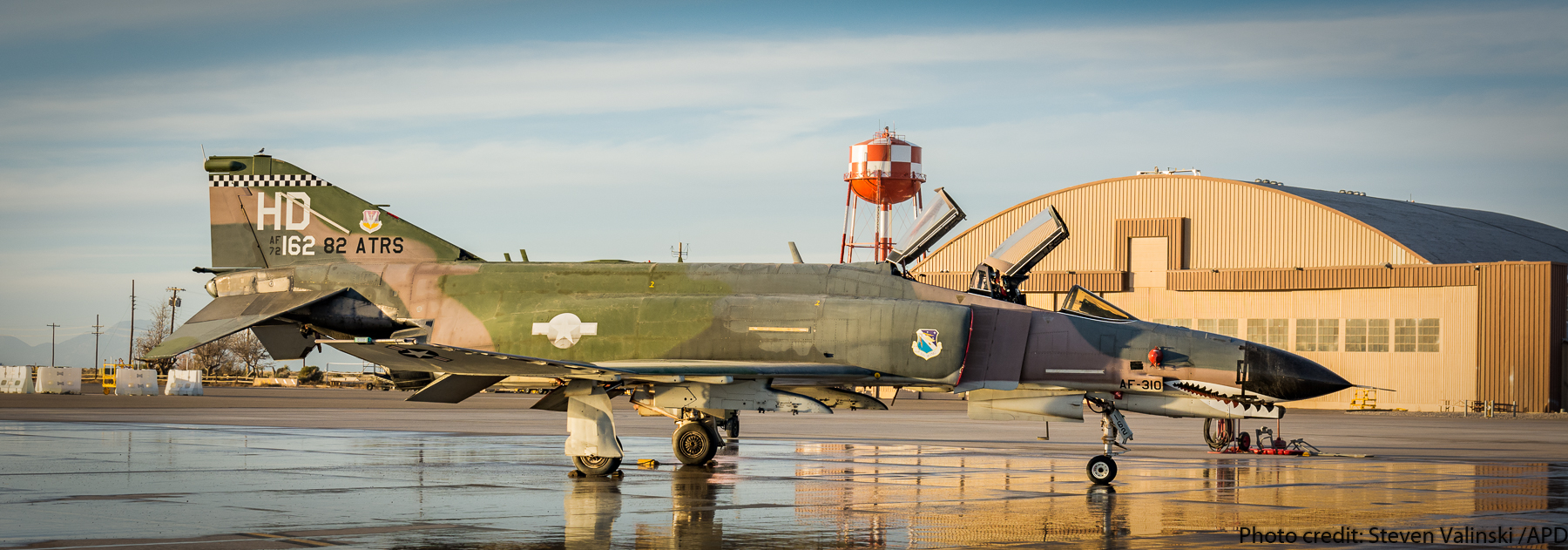 A pilot remotely controls a Q-F4 Phantom as it takes off from the